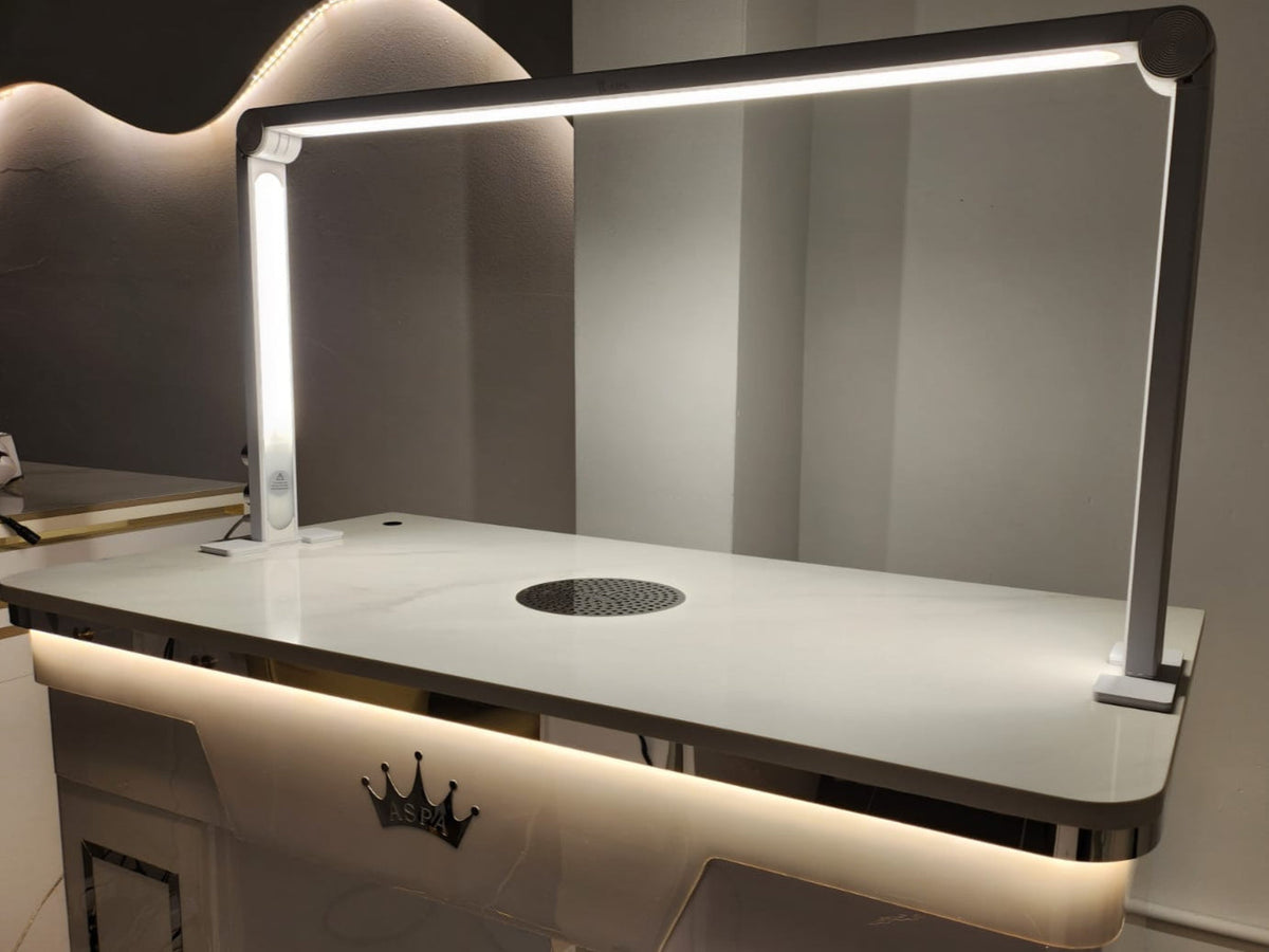 Modern table light with a reflective surface and built-in cooktop.