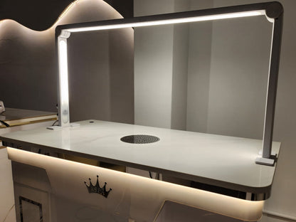 Modern table light with a reflective surface and built-in cooktop.